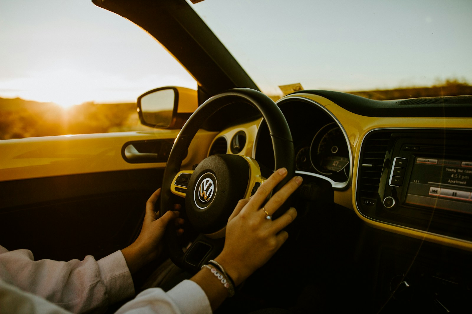 person driving car during daytime, auto